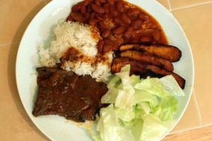 La Bandera (Dominican Flag)- National Dish in the Dominican Republic.  Rice, Beans, Salad, Beef, and Fried Plantains Among other delicious food, this dish is most likely to be served everyday in Dominican households.  How could anyone ever get tired of this? It is absolutely delicious. 